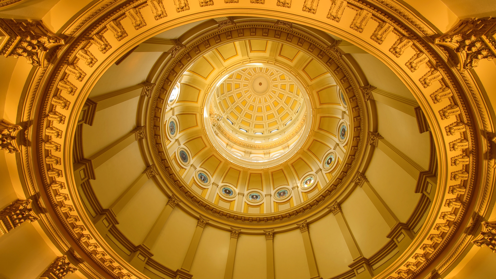 A close-up inside view of gold dome of Colorado State Capitol Building.