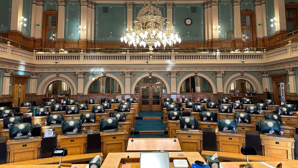 Empty chairs in the Colorado House of Representatives.